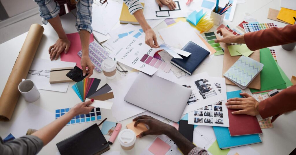 A team of people looking at branding materials