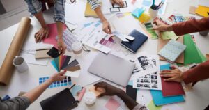 A team of people looking at branding materials